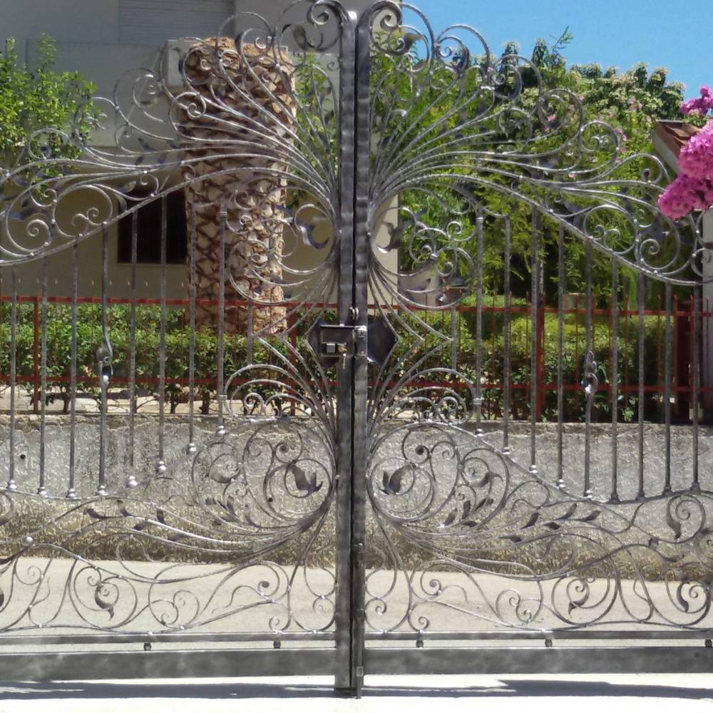 Decorated gates in wrought iron made in italy