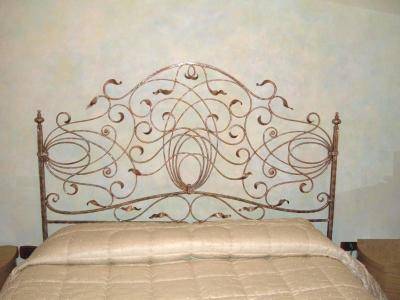 Antiqued wrought iron bed, entirely hand-crafted