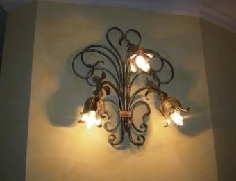 Wall-mounted lighting fixtures with three lightbulbs