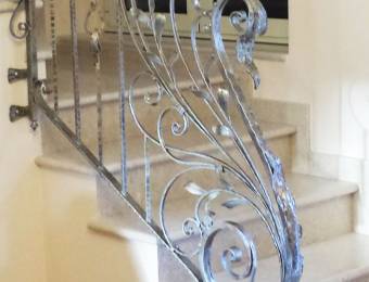 Railing for interior stairway in hand-crafted wrought iron,