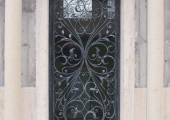 Wrought iron door with decorations of leaves