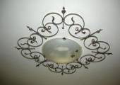 Floral ceiling fixture in wrought iron