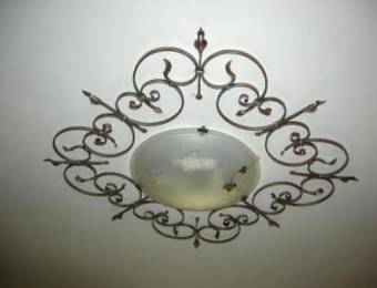 Floral ceiling fixture in wrought iron
