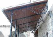 Canopy with twisted pillars in wrought iron