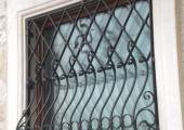hammered hand made wrought iron window protection with decorations