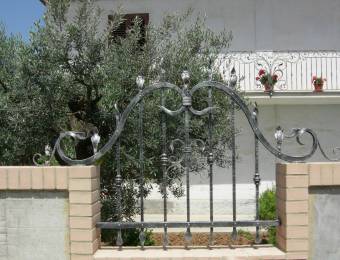 small wrought iron Fence with curly decorations