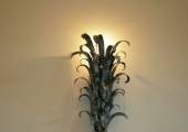 Wall-mounted lighting fixture with leafs work
