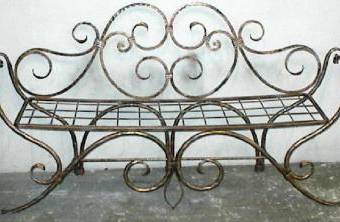 Wrought iron bench with floral decoration