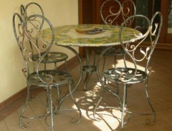 Wrought iron chairs with table