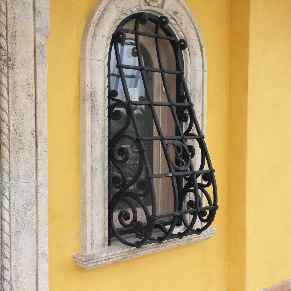 Protection grille for window in wrought iron