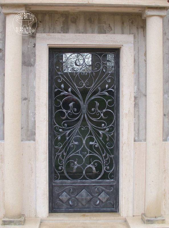 Wrought iron door with decorations of leaves