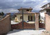 Wrought iron Gates and entrance door with copper