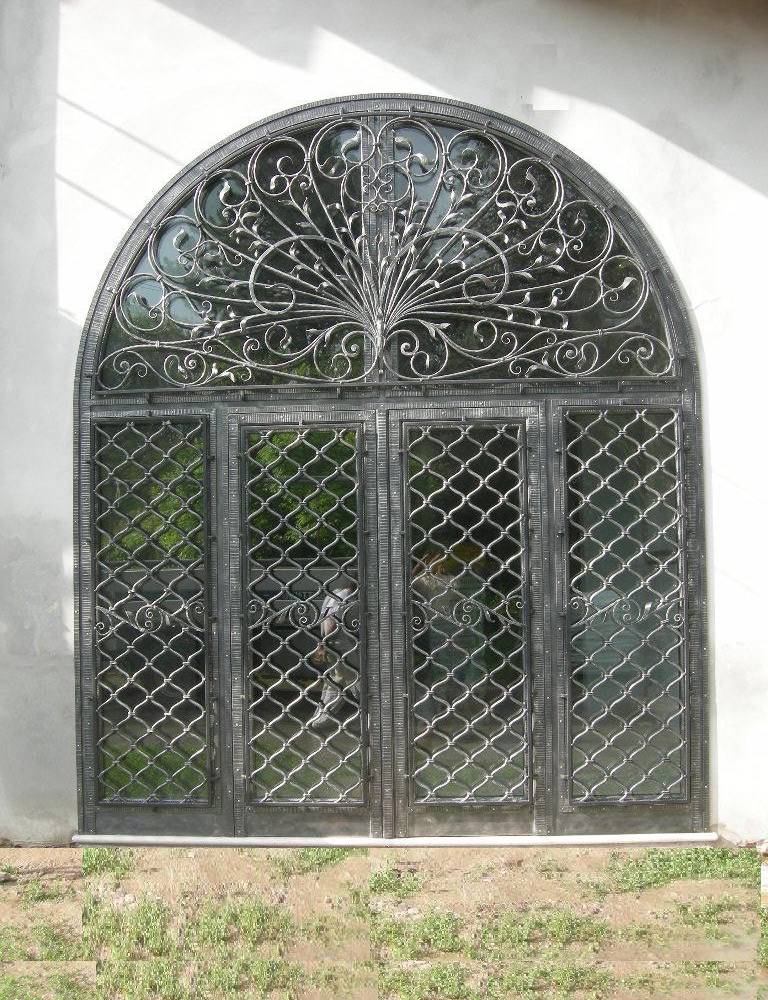 hammered and large wrought iron entrance door