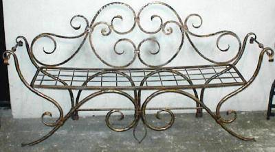 Wrought iron bench with floral decoration