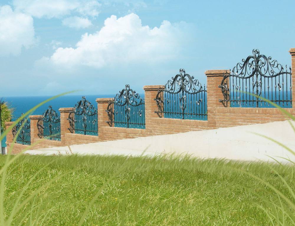 Wrought iron fence with curly decorations