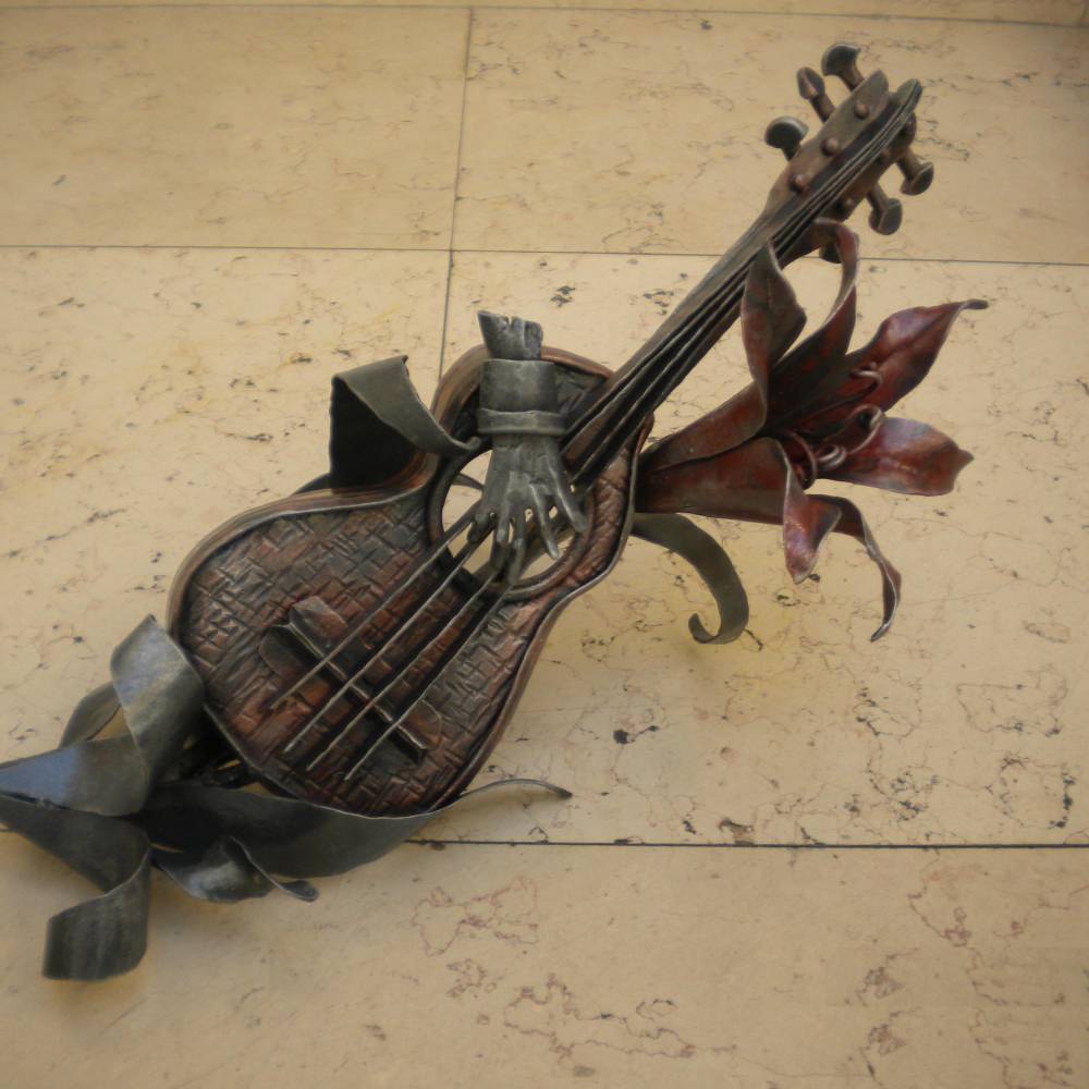 hand made wrought iron sculpture representing a guitar